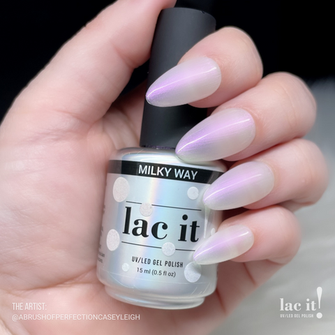 en Vogue Lac It! Milky Way sheer soft white with pearlescent hues of pink, yellow, and blue UV/LED gel nail polish for professional nails and extensions on manicured nails holding bottle