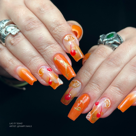 en Vogue Lac it! SoHo orange UV/LED gel polish for professional nails and extensions shown on coffin shaped nails with nail art