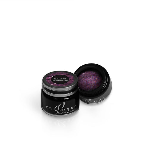 en Vogue belladonna purple, magenta, and gold microglitter gel polish for professional nails and extensions shown in container