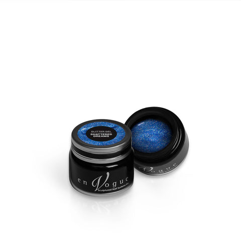 en Vogue shattered-dreams jelly blue base with circular iridescent glitter gel polish for professional nails and extensions shown in container