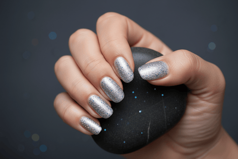 Minimalist silver glitter gel nails with electric blue and purple flashes - Akzentz Gel Play Celestial Lunar
