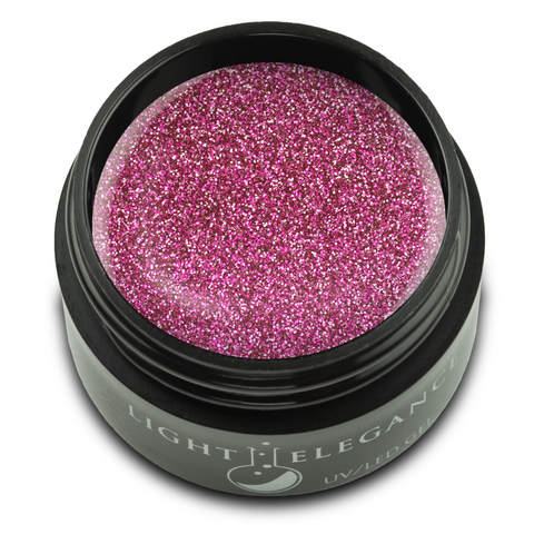 Dark fuchsia small to medium glitters with flashes of lighter pink a touch of gold sparkle. This dark glitter has just the right pop of brightness, balancing sophistication and fun!

Safari Sweetheart UV/LED Glitter Gel, 17 ml.

Coverage: Opaque
Effect: Glitter